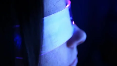 Experience the cutting edge of technology as young woman immerses herself in Vidéo 275005044