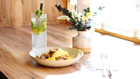 Experience a Delicious Brunch Setup featuring Fresh Ingredients and Refreshing Stock Footage 311874122