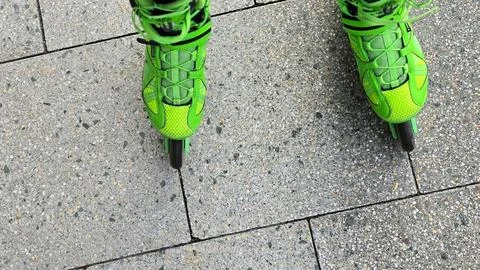 Experience Dynamic Rollerblading on Urban Pavement for a thrilling blend of Stock Photos