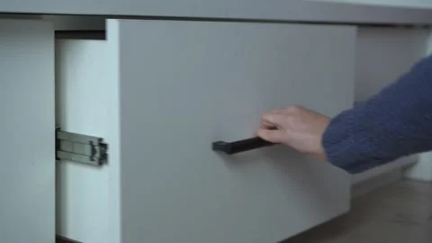 Experience the effortless elegance of opening a modern drawer with utmost ease Stock Footage 318543990
