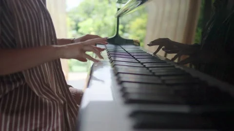 Experience the Elegant Piano Playing Set in a Beautiful and Natural Surrounding Stock Footage 310929657