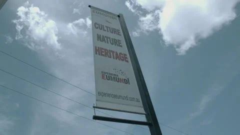 Experience Eumundi Markets Banner Against Sky at Sunshine Coast Queensland Stock Footage 341293700