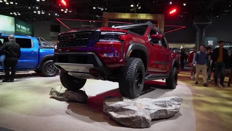 Experience exhilarating dynamic red pickup truck showcase at Auto Show event 動画素材 291625728