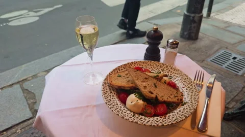 Experience a Gourmet Meal Presentation featuring Sparkling Wine alongside Fresh Stock Footage 318497894