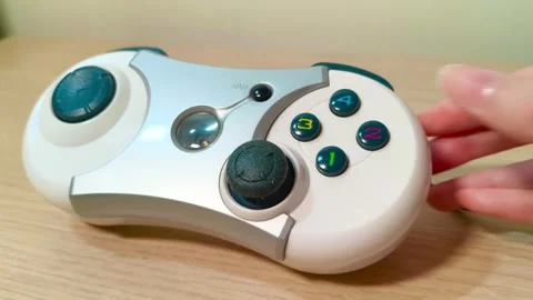 Experience immersive gaming with a classic controller, feel the nostalgia and Video stock 318310863