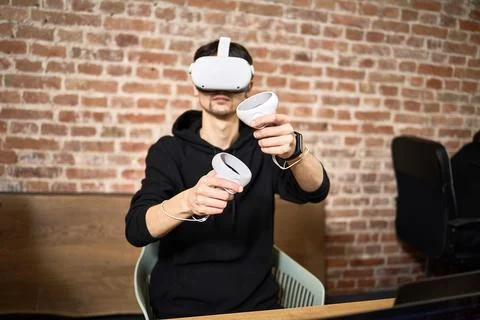 Experience immersive virtual reality with a headset and controllers in a mode Stock Photos