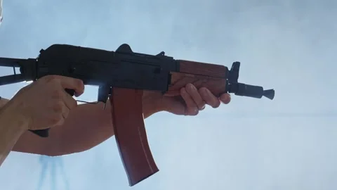 Experience intense target practice with training weapon in indoor shooting range Video stock 308313831