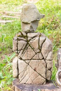 Experience the intriguing sight of a stone resembling a human body and head,  Stock Photos
