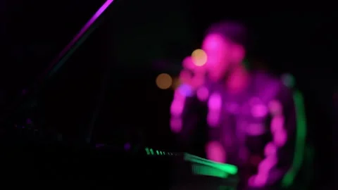 Experience a Live Performance Enveloped in a Stunningly Vivid Neon Light Stock Footage 291024837