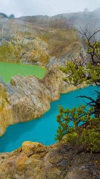Experience the mesmerizing of Kelimutu's Three Color Lake in Ende Stock Photos