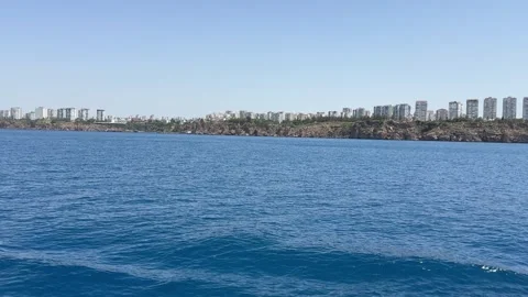 Experience the mesmerizing scenery of Antalya, Turkey, where the deep blue sea Stock Footage 297960693