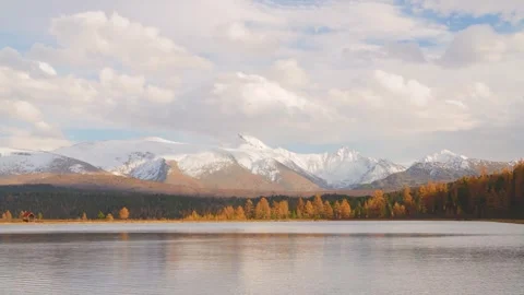 Experience the peaceful charm of Kidel Lake surrounded by autumn colors and Stock Footage 319945514