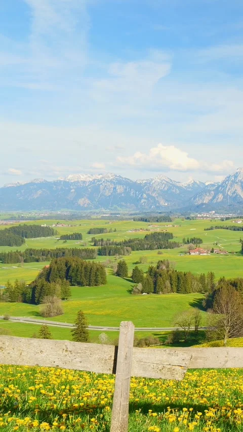 Experience the peaceful transformation of clouds and distant mountain views i Stock Footage 309227305
