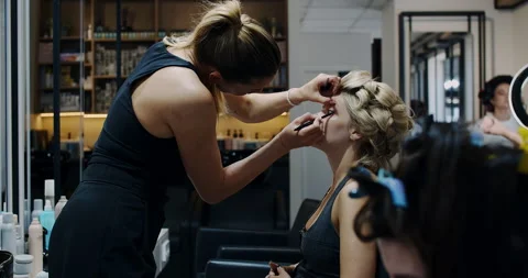 Experience Professional Makeup Application in a Chic and Stylish Salon Stock Footage 318222805