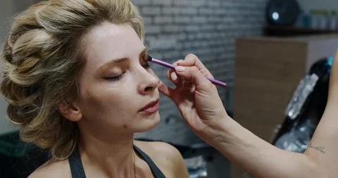 Experience a Professional Makeup Application in a Sophisticated and Stylish Stock Footage 318220834
