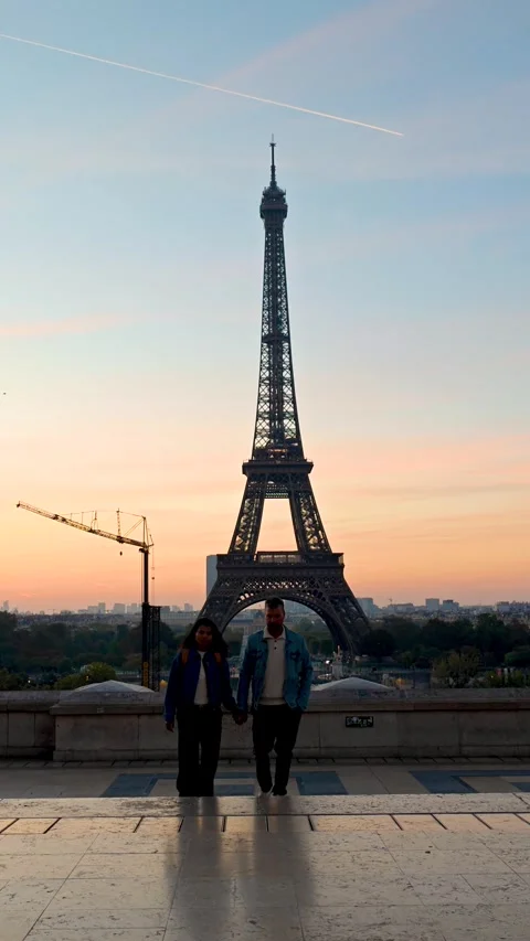 Experience romance at the iconic Eiffel Tower as the sun sets in Paris Stock-Footage 347939890