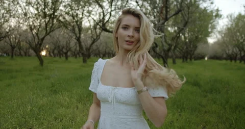 Experience the serene beauty found within a lush and vibrant orchard environment Stock Footage 301708448