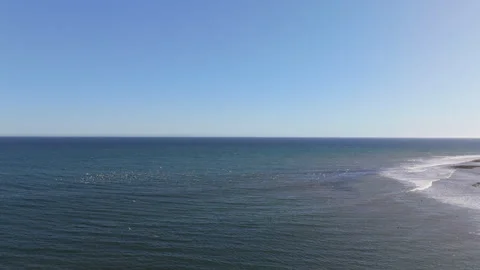 Experience a Serene Ocean View with Extremely Clear Blue Skies and Refreshing Stock Footage 305429079