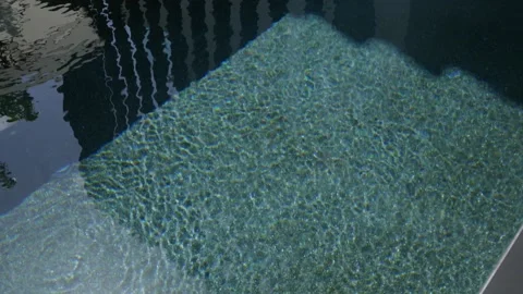 Experience the serene reflection in the crystal clear water, an inviting and Stock Footage 285795172