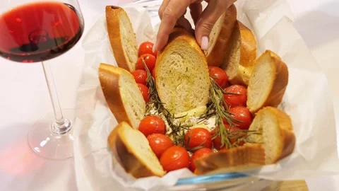 Experience sheer bliss of wine accompanied by delightful snacks. Elevate your Stock Footage 271658274