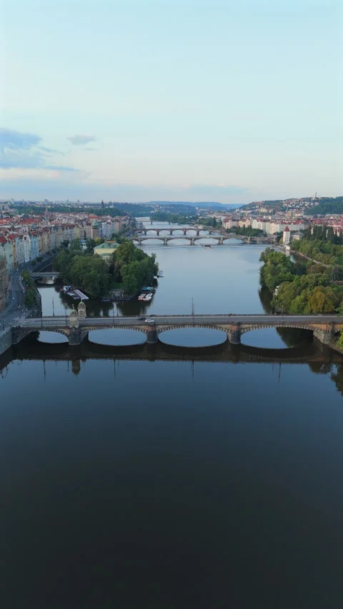 Experience Stunning Aerial Views Showcasing Pragues Historic Bridges and Serene Stock-Footage 320163209