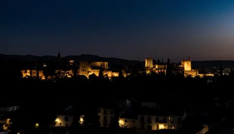 Experience the stunning and dramatic nighttime view of the Alhambra fortress Stock Photos