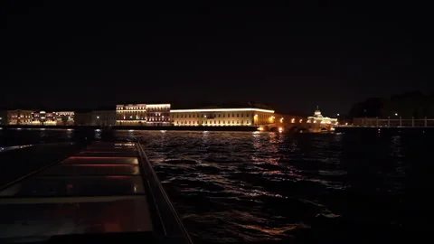 Experience a Stunning Night View of City Lights Reflecting on the Waters Surface Stock Footage 291027144
