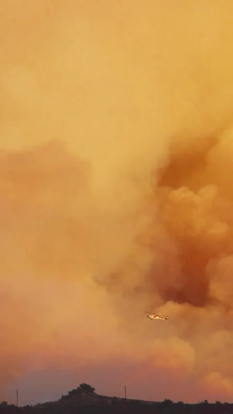 Experience stunning Slow Motion 4K of Helicopter Operations in Malibu Fire Stock Footage 299681220