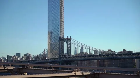 Experience the Stunning View of the Manhattan Bridge and a Skyscraper Stock Footage 291012051