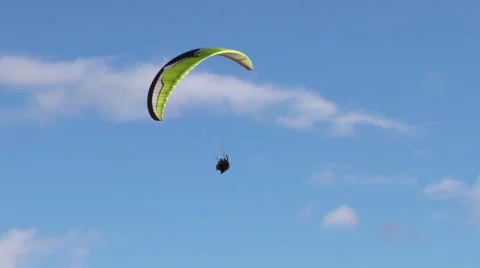 Experience the thrill of dual or tandem paragliding as you indulge in slow turns Stock Footage 59210644