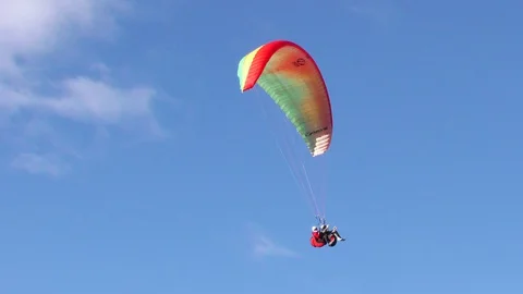 Experience the thrill of dual or tandem paragliding in Banos,Ecuador's Stock Footage 128457512