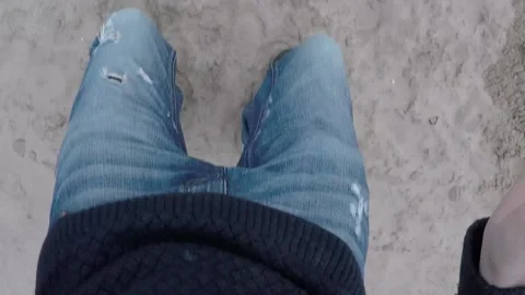 Experience the thrill as seasons collide jumping from the beach to snow in th 動画素材 259114448