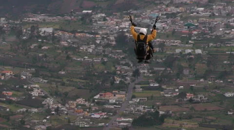 Experience the thrill of tandem or dual paragliding as skilled pilots soar over Stock Footage 58603272