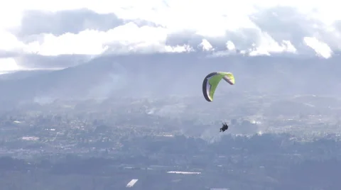 Experience the thrill of tandem or dual paragliding as skilled pilots soar over Video stock 59209473