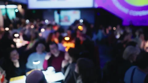 Experience the thrill of trivia night at a beloved pub, where friends come Stock Footage 272440163