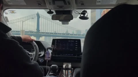 Experience the thrill of an urban drive beneath the iconic and stunning bridge 스톡 동영상 295072693
