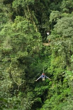 Experience the thrill of ziplining through the breathtaking Ecuadorian Andes Foto stock