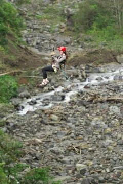 Experience the thrill of ziplining through the lush Ecuadorian rainforest in Foto stock