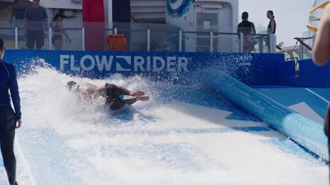 Experience the thrilling and exciting FlowRider on a cruise ship vacation Stock Footage 312766582