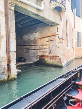 Experience Venice while gliding along its enchanting canals in a gondola Stock Photos