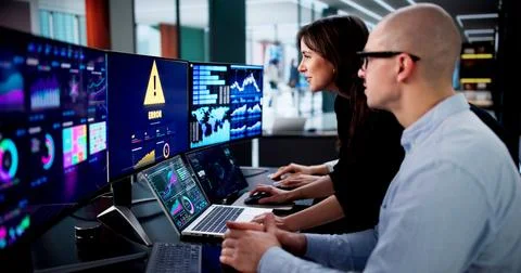 Experienced Analyst Assisting Team Members With Error On Digital Dashboard. Stock Photos