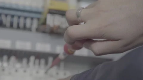 Experienced and qualified electrician engineer works in electrical cabinet Stock Footage 105286564