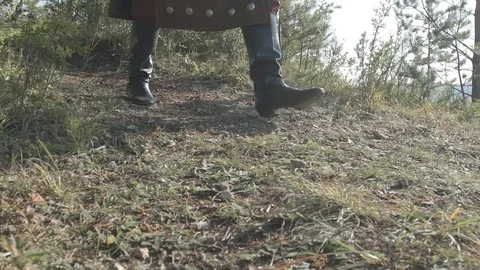 Experienced archer walking along on grass in summer afternoon. Video stock 82574218