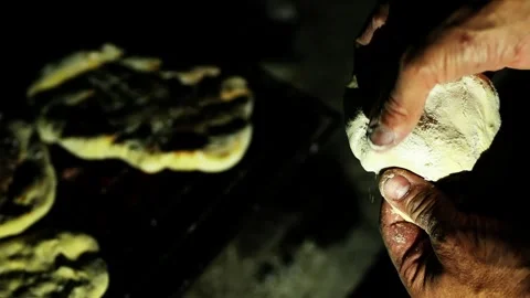 Experienced baker hands kneading traditional bread dough outdoors at night Stock Footage 337001583