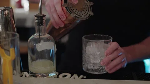 Experienced Bartender Precisely Combines Ingredients To Create Traditional Sour 스톡 동영상 323774436
