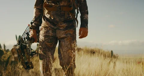 Experienced bowhunter takes a stroll through the prairie Stock Footage 101126255