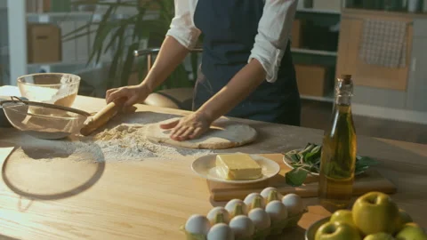 An Experienced Chef Sprinkles the Dough with Flour. Startup. Stock Footage 156571807
