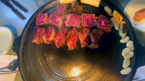 Experienced chef uses precise cutting and controlled heat to enhance flavor and Video stock 301518502