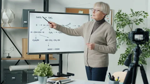 Experienced Chemistry teacher recording tutorial for science blog with video Stock Footage 203867117