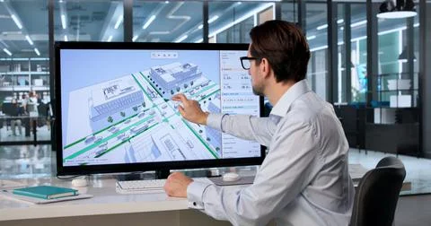 Experienced Civil Engineer Uses 3D Software On Computer Analyzing City Bike L Stock Photos